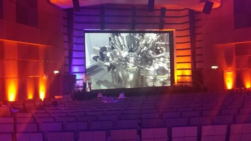 Large projection screen installed inside an event venue